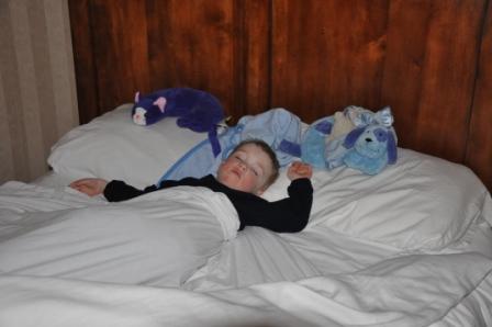 Thomas sleeping while Ron and the big kids were ice skating around the Olympic Oval