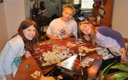 Kelly, Jeffery & Bethan enjoy a game of Risk