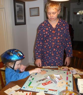 Thomas beats Jeffery at Monopoly (the helmet helped)