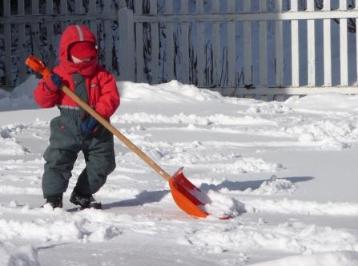 Thomas helps clear the driveway