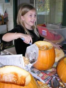 Bethan scoops out the pumpkin seeds