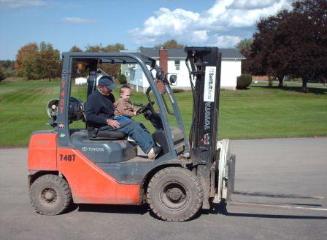 Thomas gets to drive the forklift at the apple farm!