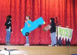 Performing the skit on stage at school