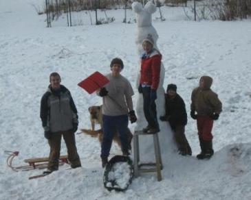 Grandpa sent this photo of the TALL snowman built after Christmas