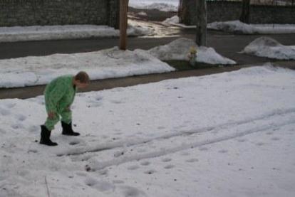 Jeffery checks out the sleigh tracks in our front yard