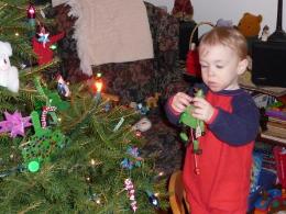Thomas adds some ornaments