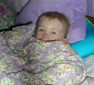 Thomas in Bethan's princess bed