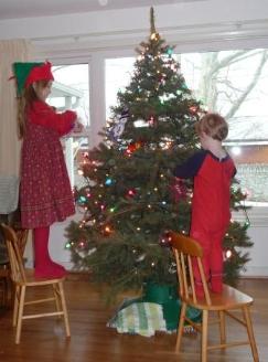 Bethan and Thomas adorn with ornaments
