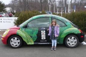 Bethan with the Eric Carle bug car