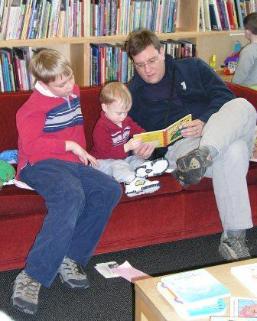 Reading books in the library that has books filed by illustrators.