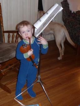 Thomas gets ready to play his violin