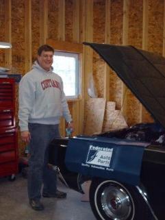 Ron enjoying engine work in his new barn.