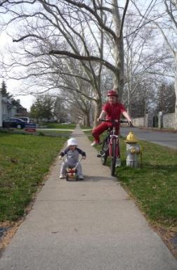 Jeffery with his new bike and Thomas on an old Radio Flyer