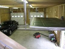 garage floor from stairs and our new tiller