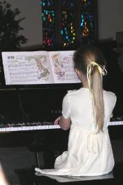 Playing their recital pieces.