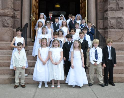 27 of the 80 receiving their First Communion at Saint Mary's