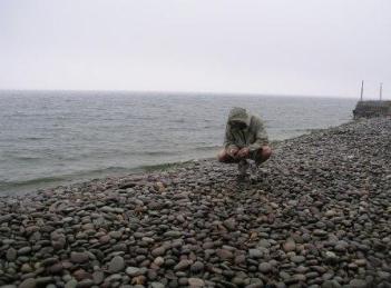 Keith Chamberlain collecting stones by Bev's