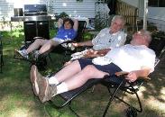 Aunt Lisa, Grumpy, and Grandpa moniter the grill