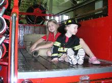 Riding in the back of a hose truck