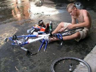 Cousin Luke works on his bike