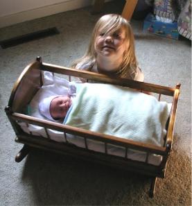 Rocking Thomas in the baby doll cradle
