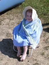 Thomas after his swim and all tuckered out by the campfire