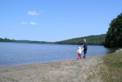 Brothers walking and girls canoeing.