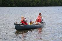 Thomas's first ride in the canoe
