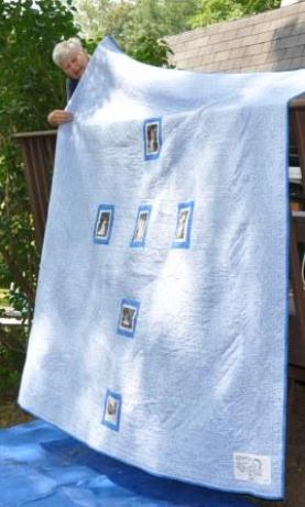 The back side of the quilt with photos of the 5 family weddings and our house