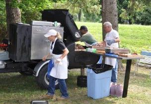 Donna, Ernie and Tom tending to the pig