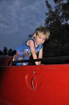 Brooks atop Grandpa's fire truck