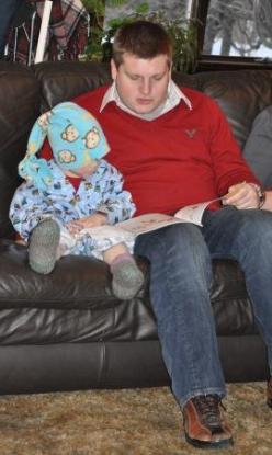 Thomas enjoys his gifts with Cousin Peter