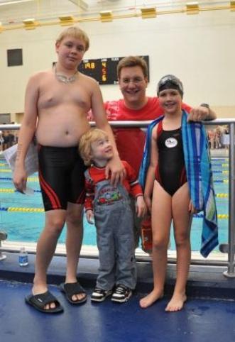Happy Daddy with swim kids