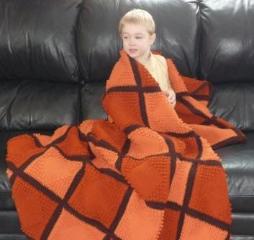 Thomas snuggled in Daddy's afghan