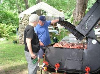 Aunt Trudy and George checking on the pig