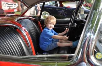 Thomas got to sit in the corvette next to Grandpa's Studebaker