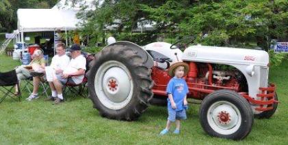 A shady spot to sit behind the tractors