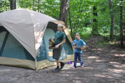 Jeffery and Bethan collect camp wood